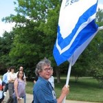 Kevin Cole carrying the CLAS banner